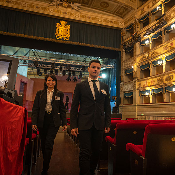 Due addetti al portierato dentro il teatro Alighieri di Ravenna